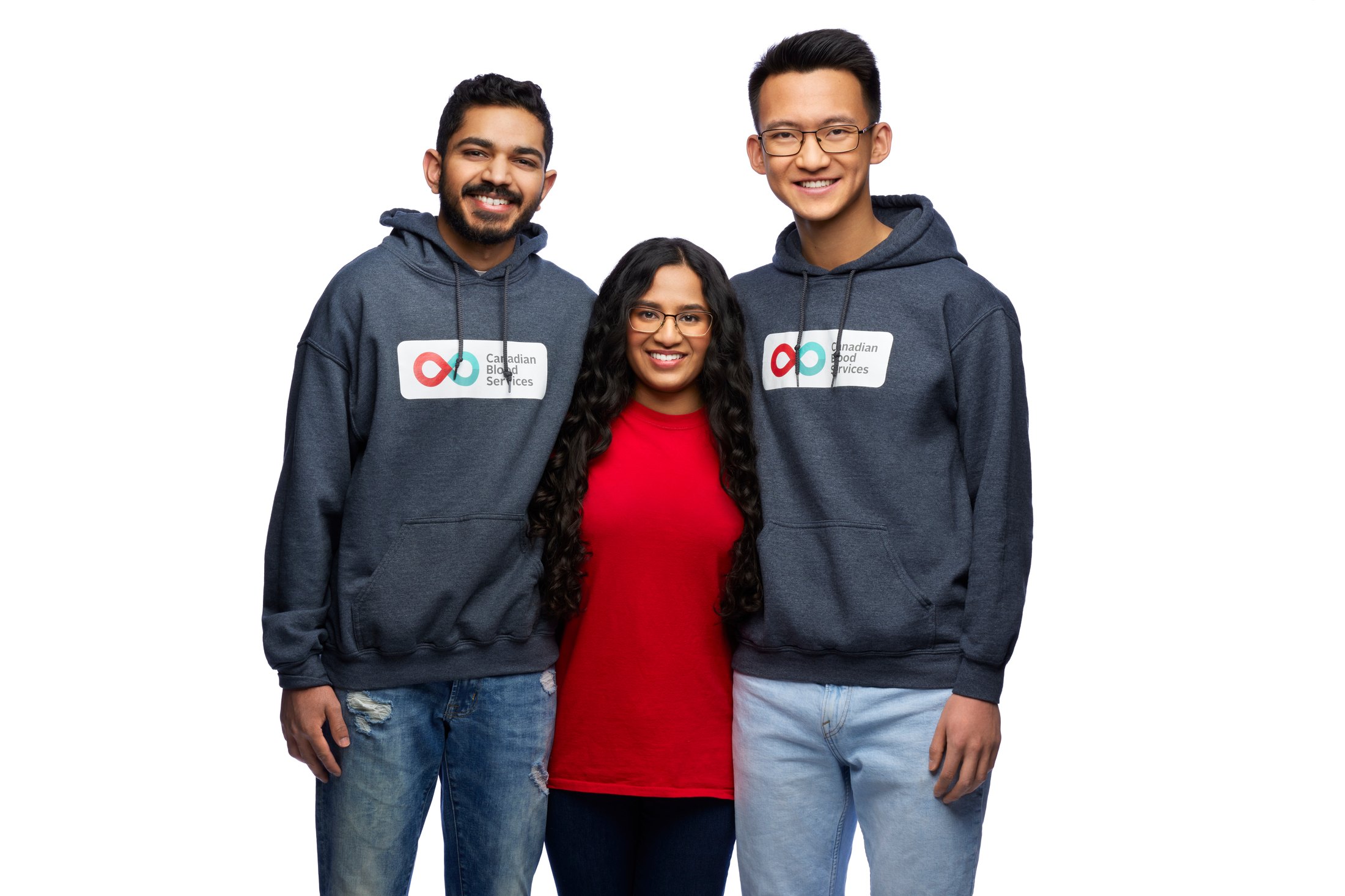 Three people together in branded hoodies
