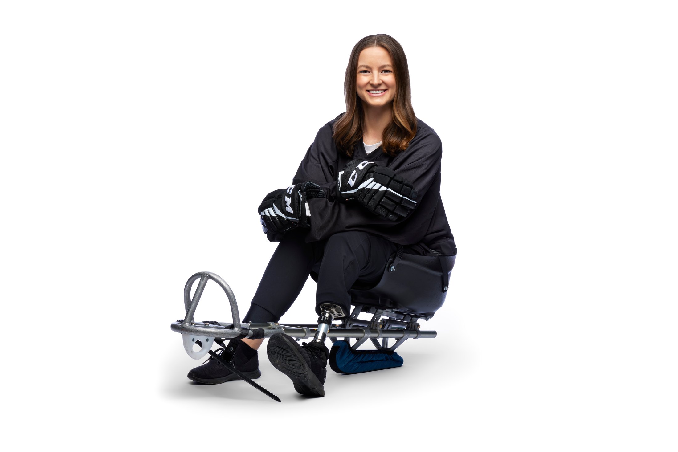 The same woman seated, the blade out in front of her