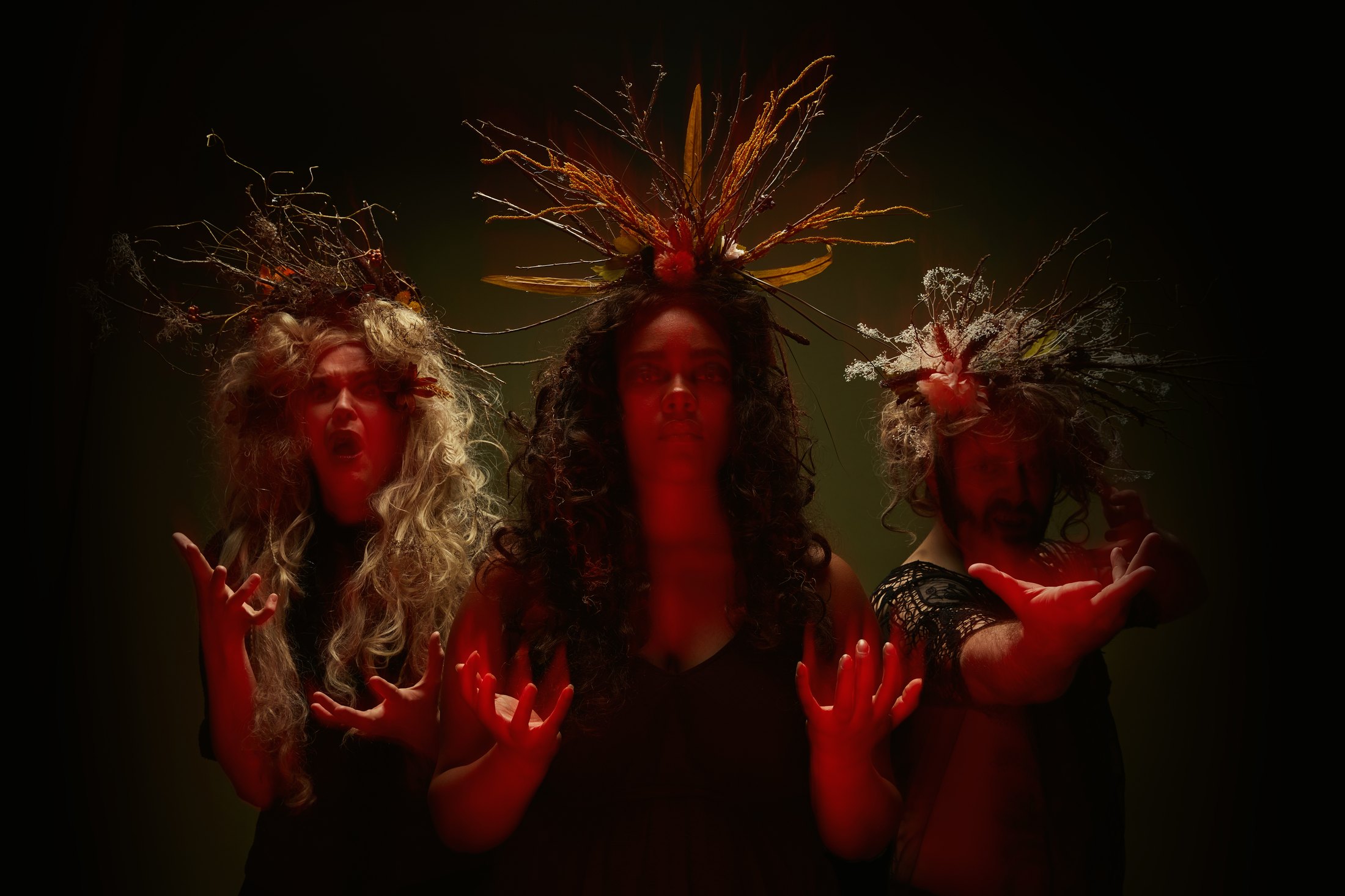 Macbeth promo, a multiple exposure in red light: three overlapping figures across one frame