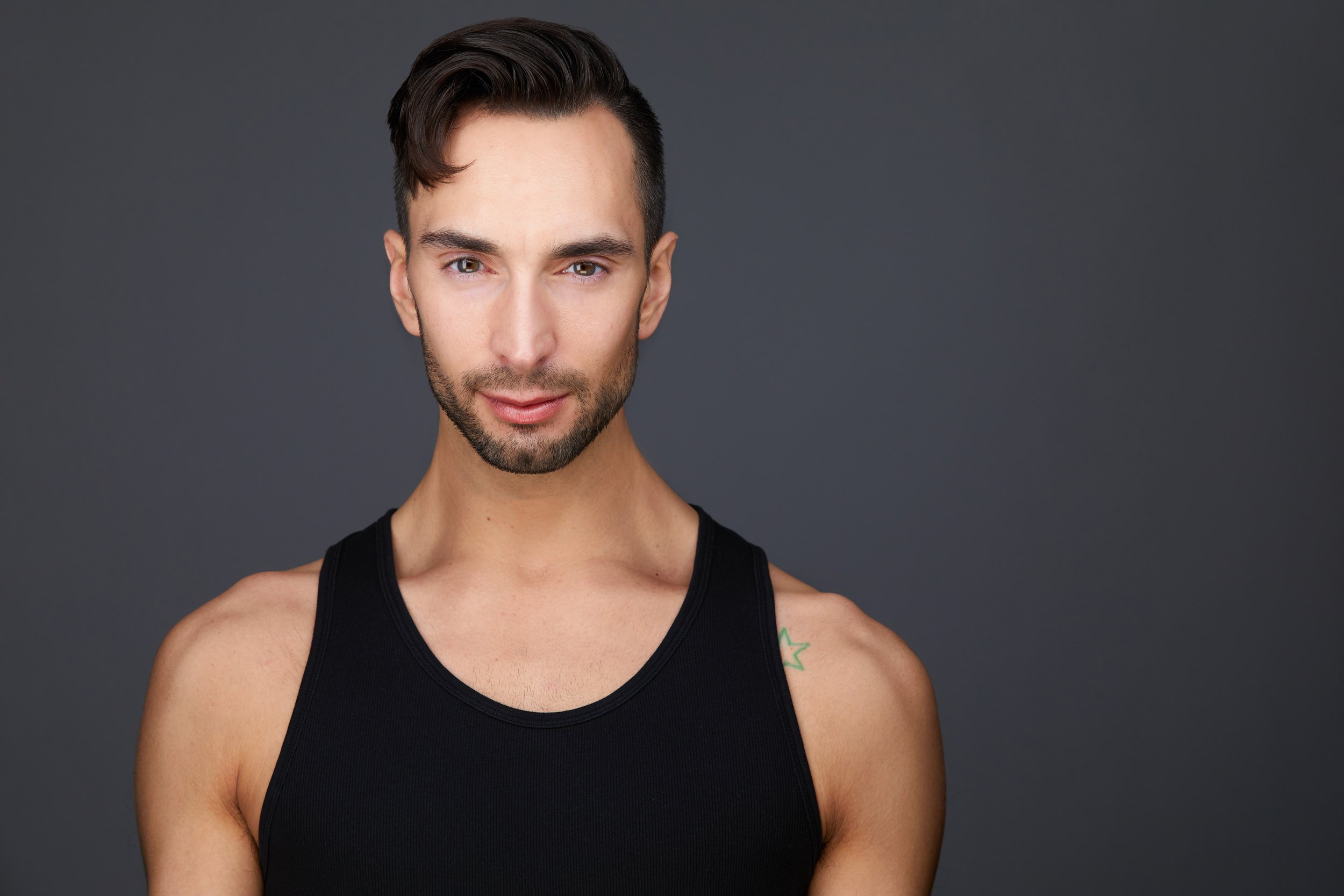 Dance headshot: a black tank top against grey