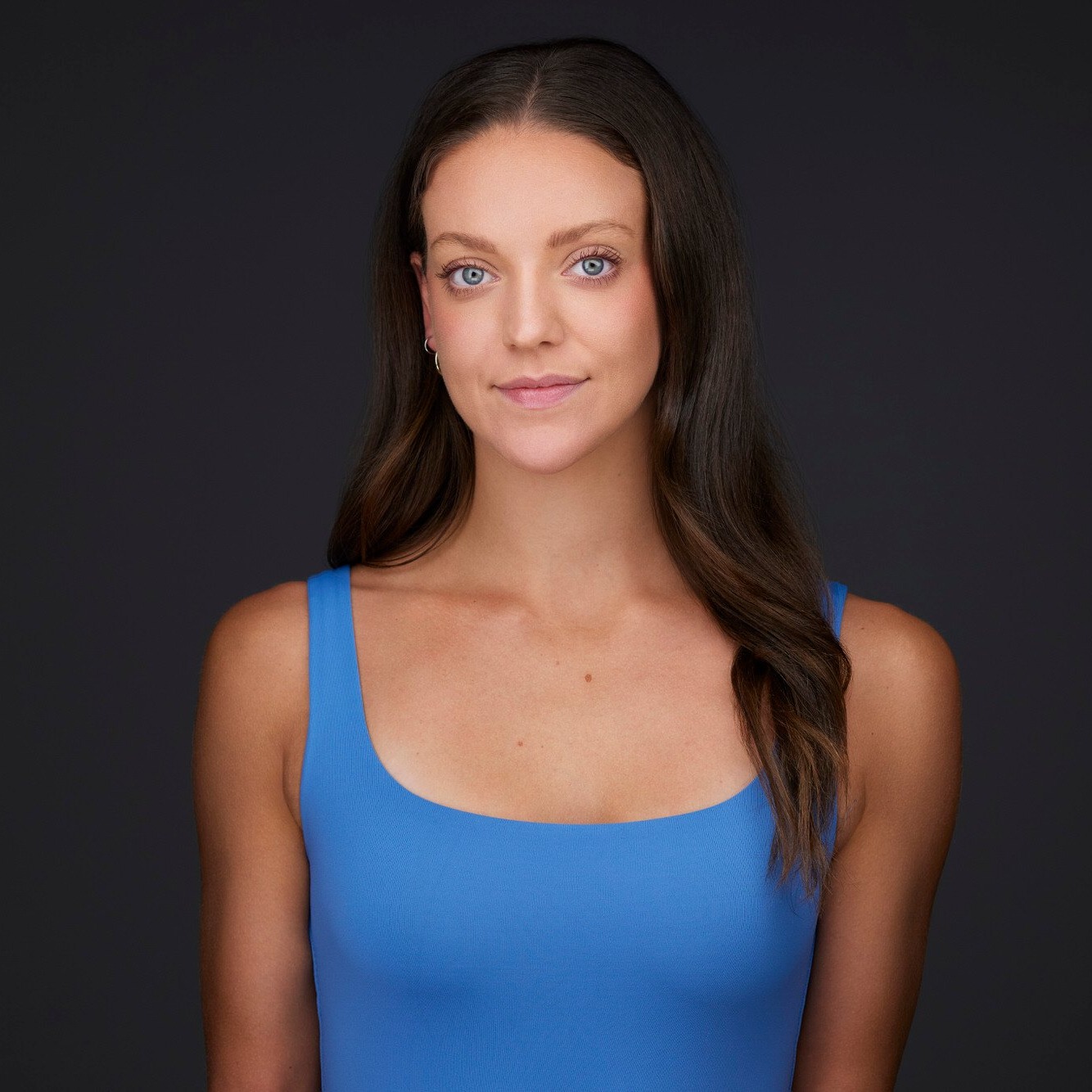 The same session, a blue top, closer