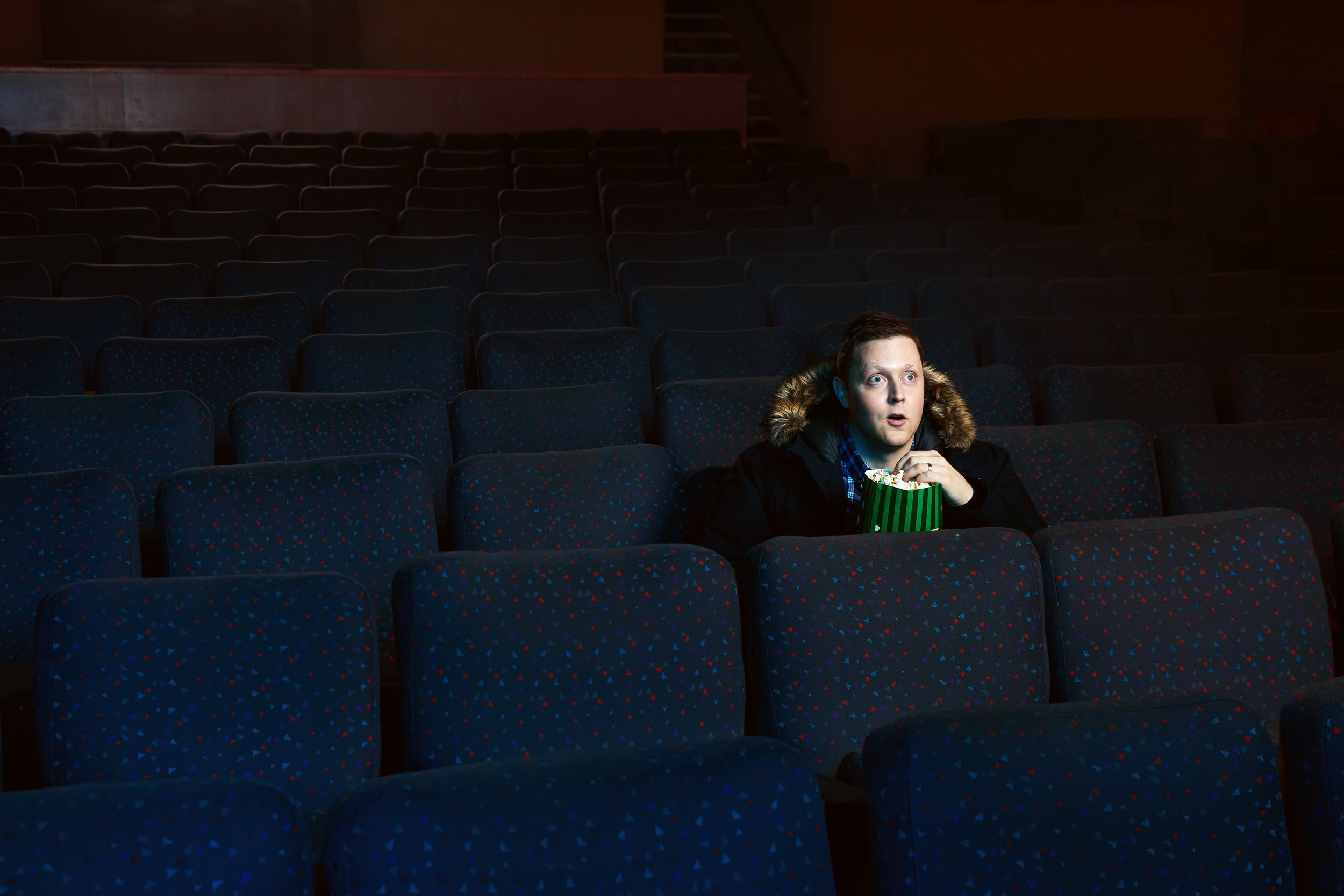 The popcorn frame, wide: Kurt McLeod small among the empty rows
