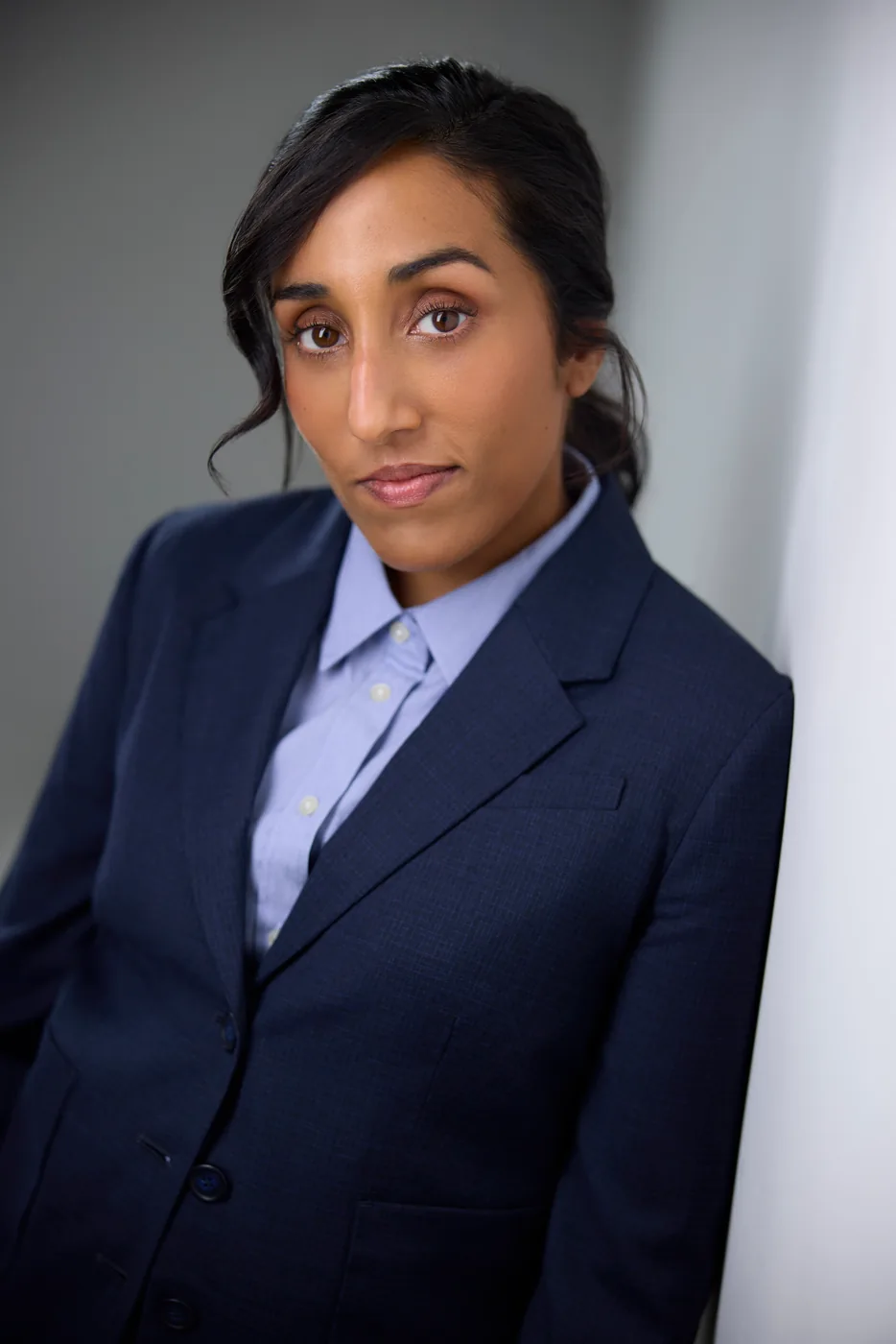 Ashley John in a navy suit, actor headshot, Edmonton