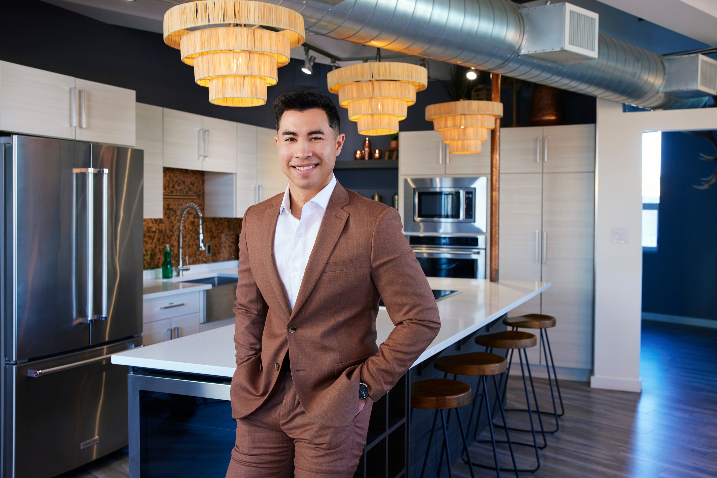 Personal branding portrait in a kitchen, brown suit, Edmonton