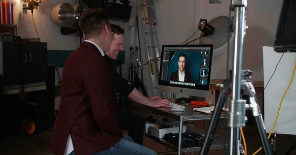 Photo — client reviewing photos on a screen