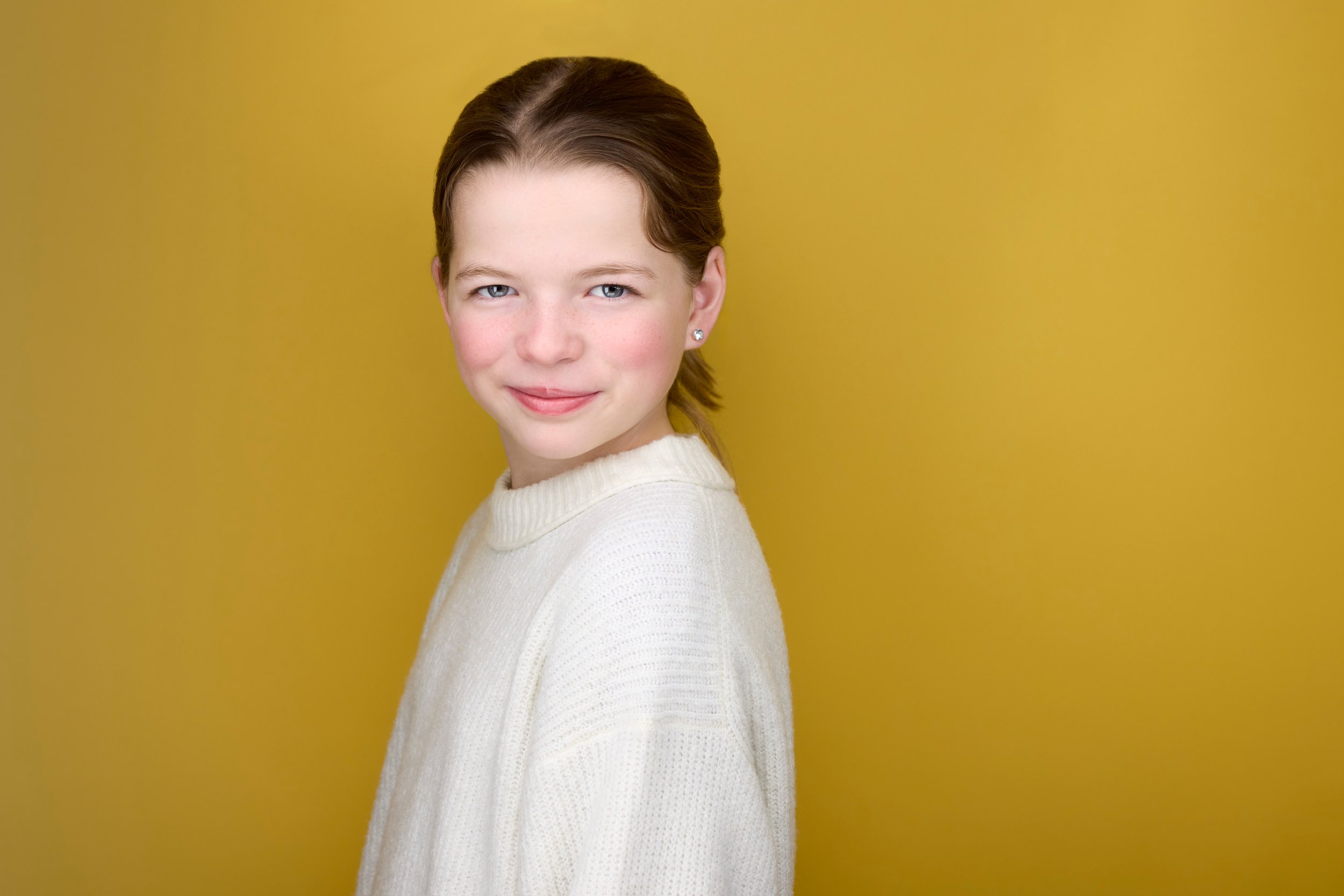 The same session, the white sweater against mustard