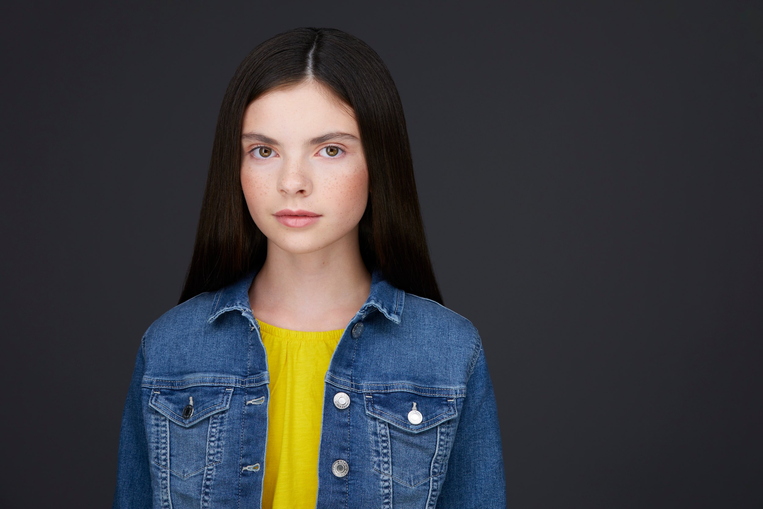 The same session, a denim jacket over yellow against grey
