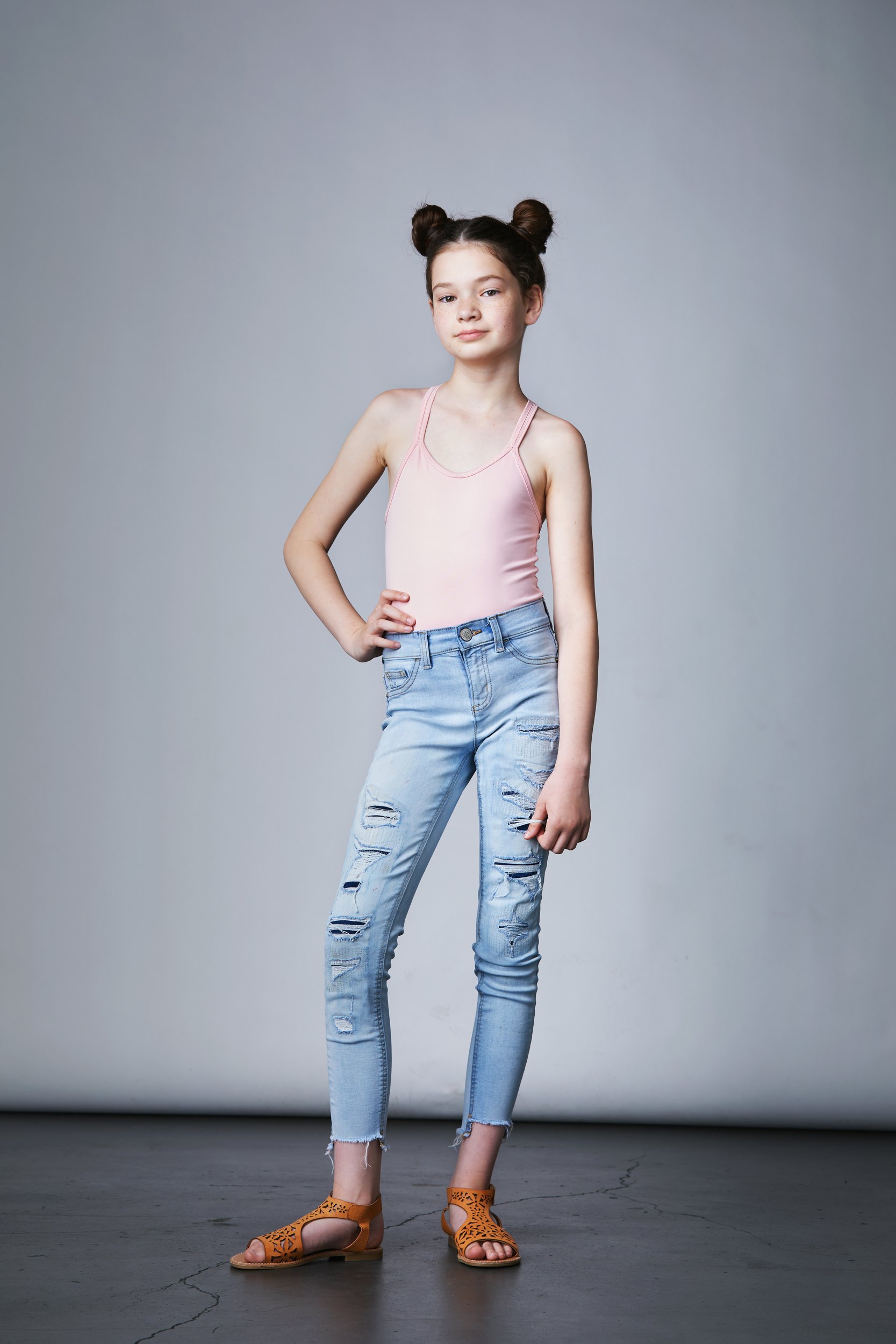 The same session, a pink tank and jeans, head to toe on white