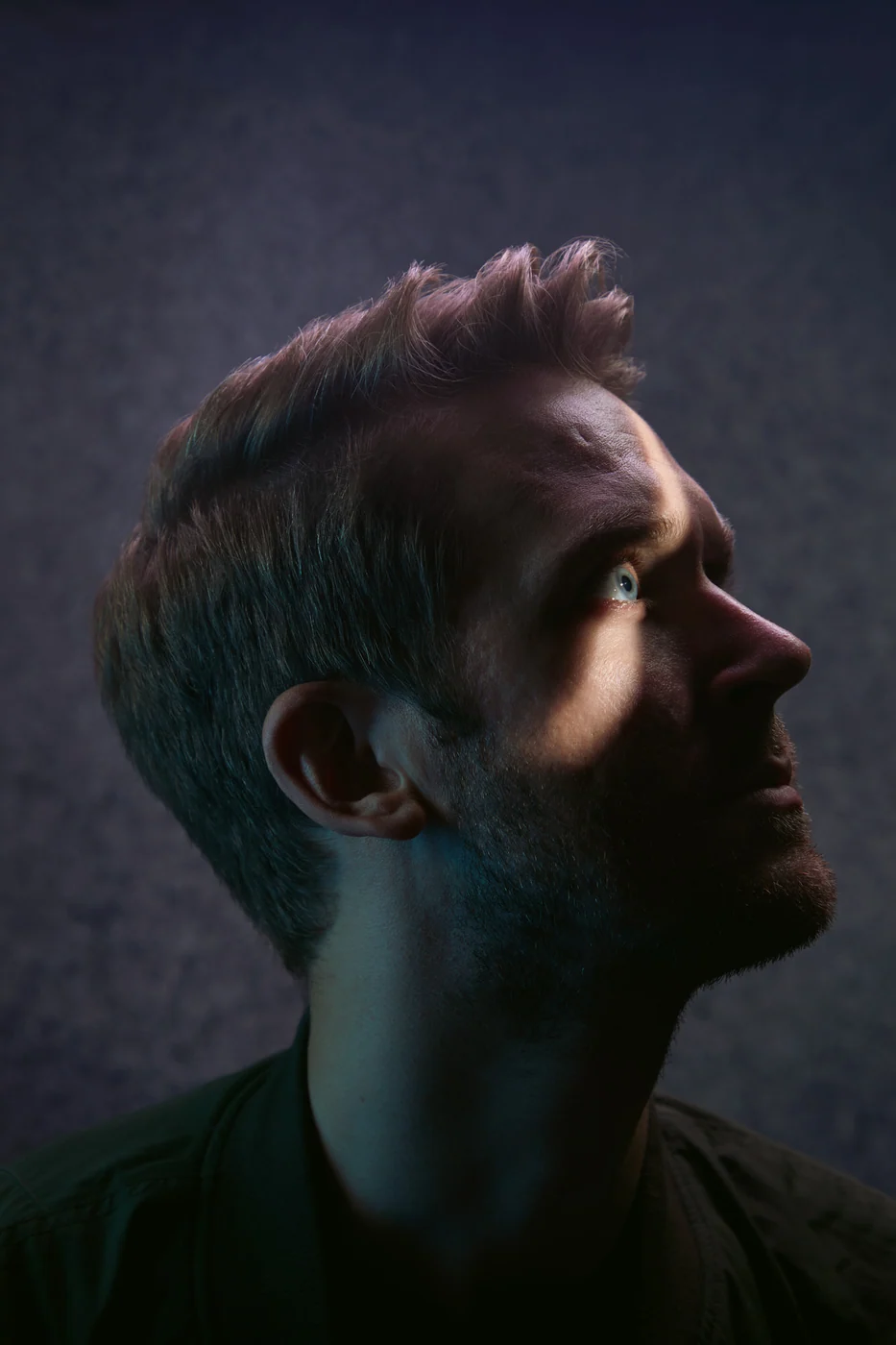 Portrait from Ryan Parker’s Slice of Light series — a single slice of light across the face, Edmonton