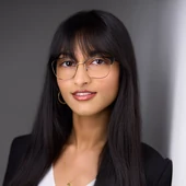 The same kind of headshot cropped small for a press release contact block
