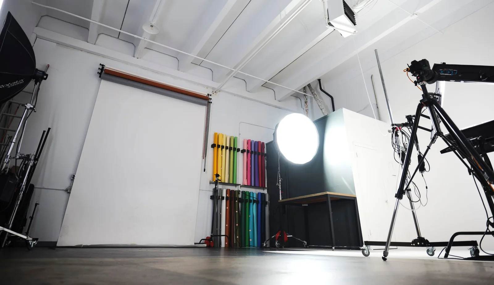 The shooting space at Ryan Parker Photography, Edmonton — lit octabox, stands and the wall of paper backdrops